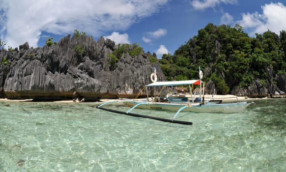 Outrigger boat on a beach in Palawan