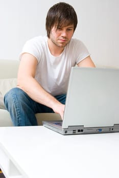 man working on laptop computer