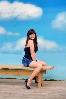 Beauty girl on the background of sky.