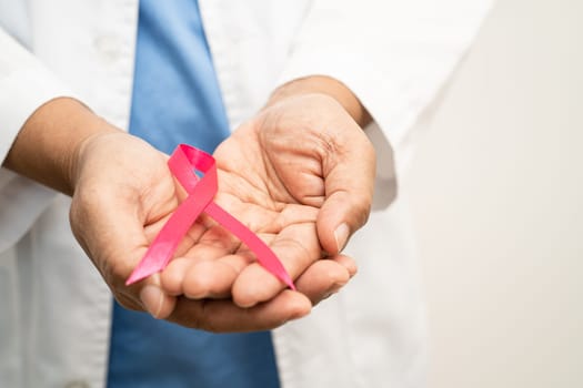 Asian woman doctor with purple ribbon, sign of Alzheimer disease day, Pancreatic cancer, Epilepsy, Lupus.