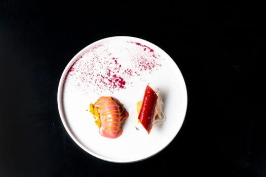 Italian Sicilian cannolo dessert closeup on a white plate macro with crust and ricotta cheese