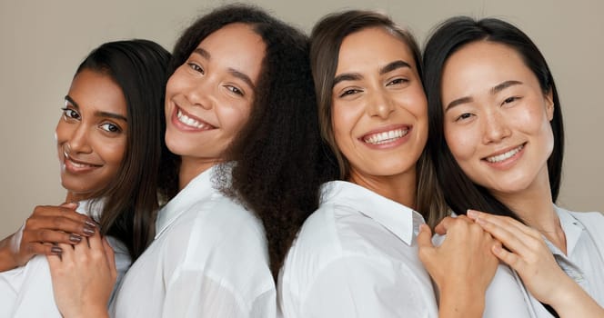 Women, group skincare and beauty with love, hug and support in diversity and inclusion on brown studio background. Friends, model or people smile together and kiss in dermatology, skin care or makeup.