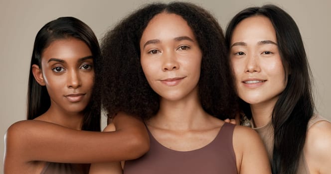 Diversity, beauty and face of women in studio for empowerment, wellness and skincare. Inclusion, friends and portrait of group of people for dermatology, natural skin and support on brown background.