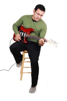 Man sitting with guitar.