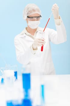 Flu virus vaccination research - woman scientist in laboratory