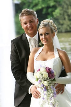 Portrait - young newlyweds - hand in hand