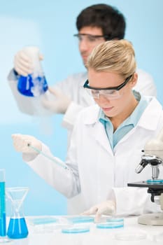 Flu virus experiment - scientist in laboratory