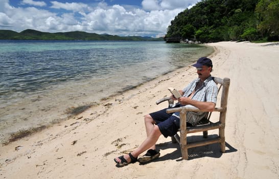 Reading on the tropical beach
