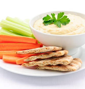 Hummus with pita bread and vegetables
