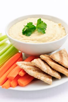 Hummus with pita bread and vegetables