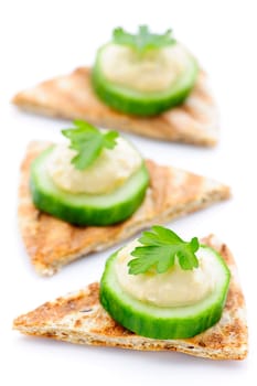 Appetizer of pita with hummus and cucumber