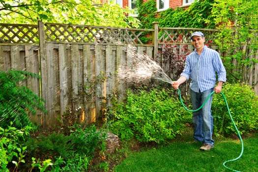 Man watering garden