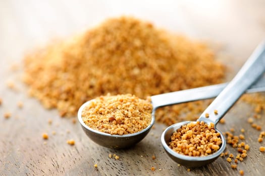 Coconut palm sugar in measuring spoons