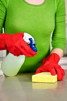 Girl cleaning kitchen