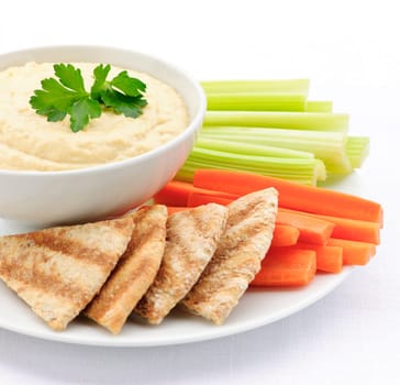 Hummus with pita bread and vegetables
