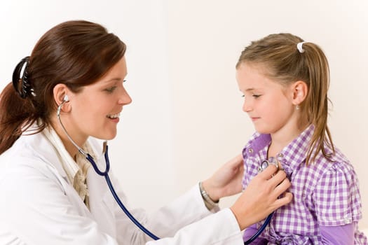 Female doctor examining child
