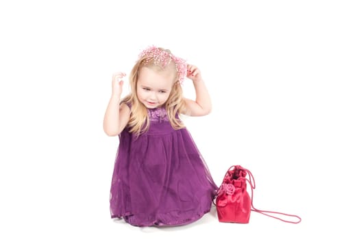 Studio shot of baby girl in gala dress