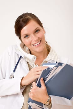 Female doctor on the phone with medical file
