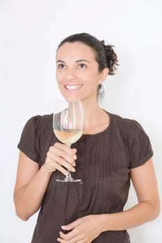 Woman tasting white wine