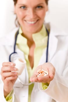 Female doctor with stethoscope holding tablet