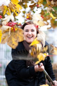 Young woman gardening in autumn