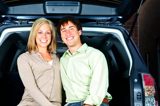 Couple sitting in back of car