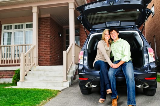 Couple sitting in back of car