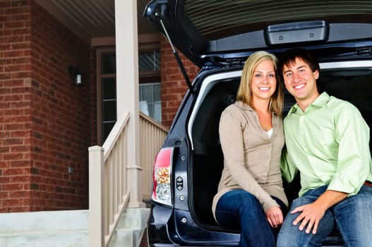 Couple sitting in back of car