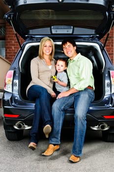 Family sitting in back of car