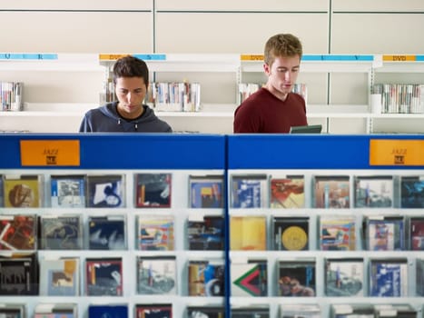 guy listening music in cd store