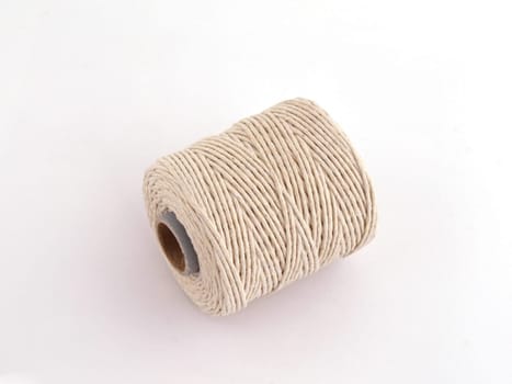 Ball of string or twine on a plain white background.