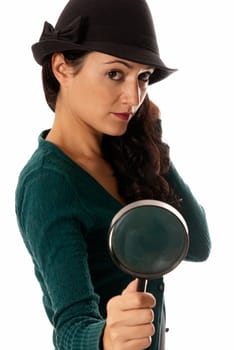 young woman with magnifier glass and hat looking for something isolated on white