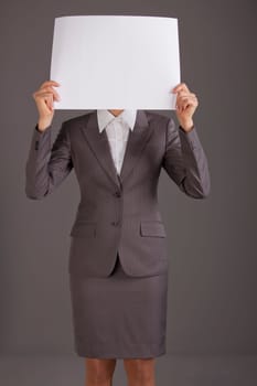 woman holding blank paper over face