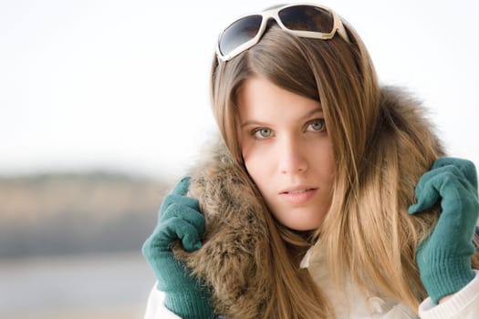 Winter fashion - woman with fur hood