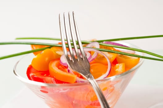 Tomato salad in glass bowl
