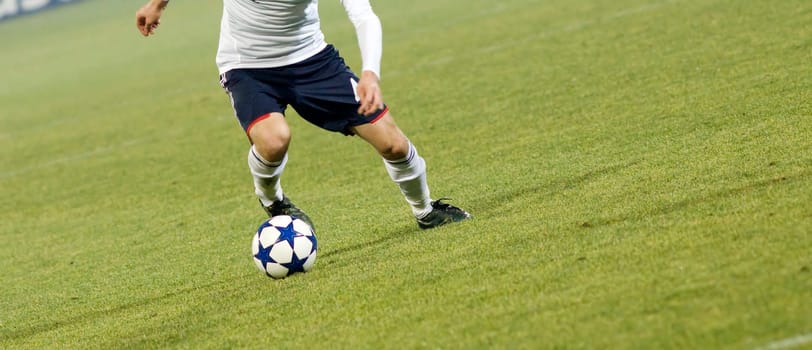 Soccer players fighting for the ball