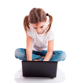 Little student girl with a laptop