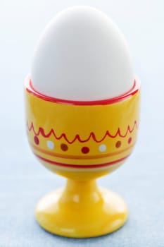 Boiled egg in cup