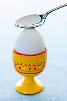 Boiled egg in cup