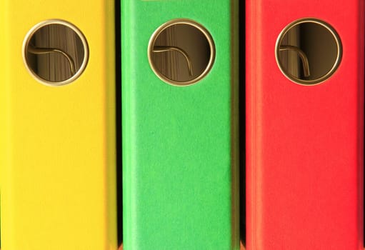 three coloured file folders