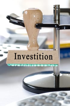Stamp with inscription Investment