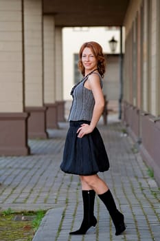 Mature, beautiful woman posing on the pa