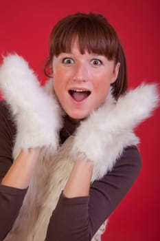 surprised woman in winter gloves