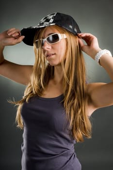 Woman in sunglasses and baseball cap