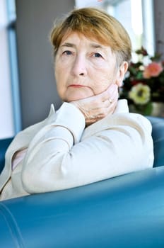 Sad elderly woman