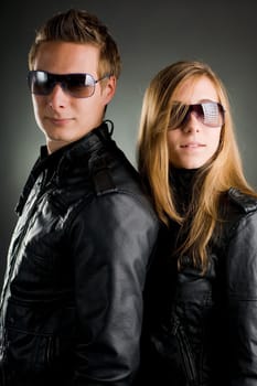 Couple with leather jackets and sunglasses