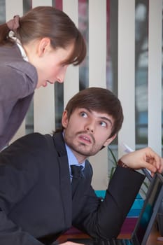 man surprised by woman at work