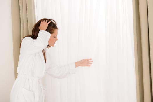 Morning bedroom - woman in bathrobe