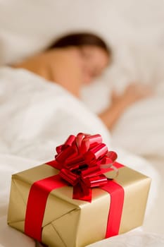 Surprise present - young woman sleeping