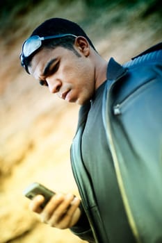 Young african man with mobile